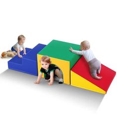 three children playing with blocks and toys on a white background, one child is climbing up the block