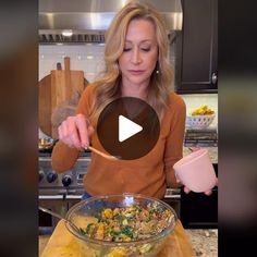 a woman is mixing food in a bowl