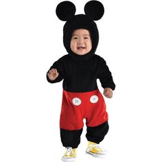 a baby in mickey mouse costume standing up