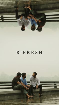 three men sitting on a bench in the rain