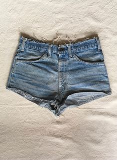 "1970s cut off jean shorts Levis 645 made in USA orange tab zip fly frayed raw waist and hem authentic age wear hem is folded up and hemmed w/fray showing label size unreadable measures, lying flat, waist-16\" rise-12\" inseam-1 hem-11\" total length-11\"" Jean Shorts Levis, 70s Levis, Shorts Levis, Burlesque Costumes, Cut Off Jean Shorts, Cocktail Dress Vintage, Daisy Dukes, Satin Blouses, Pencil Skirt Black