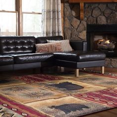 a living room filled with furniture and a fire place in the middle of the room