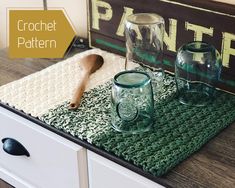 crochet placemats and cups on a dresser with the words crochet pattern next to them