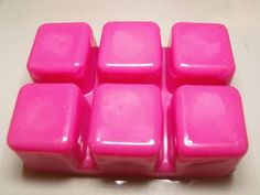 four pink cubes sitting on top of a table