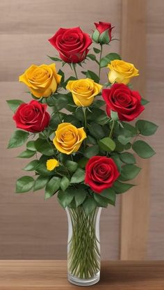 a vase filled with red and yellow roses