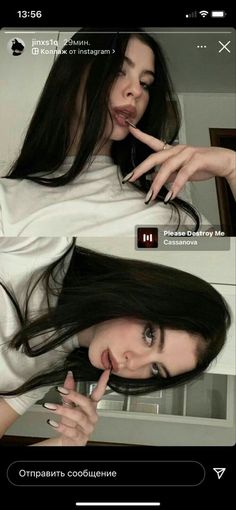 a woman with long black hair is making a funny face and pointing her finger at the camera