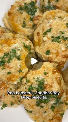 red lobster's cheddar bay drop biscuits on a white plate with green garnish