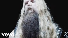 a man with long white hair and beard