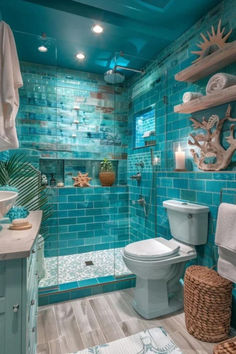 a bathroom with blue tiles and white fixtures