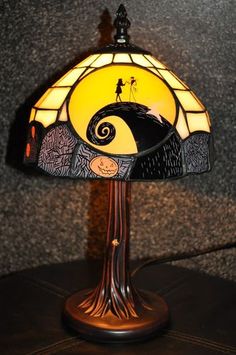 a lamp that is sitting on top of a table with the words, all of my want