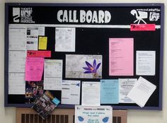 a bulletin board covered in papers and sticky notes