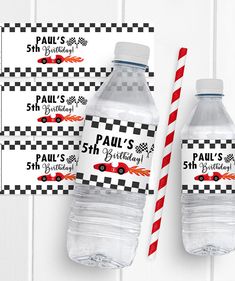 two plastic water bottles with red and white striped straws next to eachother