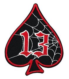 a red and black ace playing card with the letter e in it's center