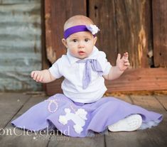 Halloween costume or Themed Photography 1950's Poodle skirt. Custom made Poodle skirt.  Full attached petticoat.  This set includes the skirt with petticoat, belt and headband.  Pick your size, pick your color.  Great for Halloween or themed pictures.  Many colors and sizes up to 24 mths available.   Size available: 3-24 months. Care:  Hand-wash with gentle soap in cold water and lay flat to dry.  Credits: Photos: Cleveland Photography : https://www.Clevelandphotography.com This skirt is made to Kids Poodle Skirt, 1950s Halloween Costume, Girls Poodle Skirt, 1950s Poodle Skirt, Cleveland Photography, Skirt Photography, Stretch Lace Dress, Newborn Tutu, Costume Toddler