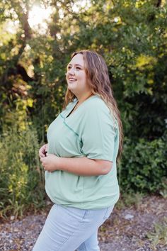 *ALL SALES FINAL* *NOT ELIGIBLE FOR RETURN* Introducing the Catherine Top! With a fresh mint green color and ribbed texture, this top is both oversized stylish and comfortable. The wide v-neck front and back add a touch of elegance, while the drop shoulder short sleeves keep it relaxed. Perfect for any occasion. Fits true to size. Model is wearing a small and is 5'6". Plus model is wearing a 1X and is 5'7". Size Chart Length Bust S 27" 58" M 28" 60" L 29.5" 62" XL 31.5" 64" 2x 31.5" 67" 3x 31.5" Versatile Green V-neck Top, Green Relaxed Fit V-neck Top Casual, Casual Green V-neck Top With Relaxed Fit, Versatile Green Top For Loungewear, Versatile Green Loungewear Top, Green V-neck Top For Everyday, Tiered Dresses, Plus Model, Teen Dress