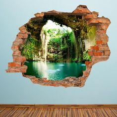 an open hole in the wall with a waterfall coming out of it's center