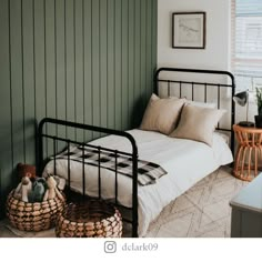 a bed sitting in a bedroom next to a wall with green paint on the walls