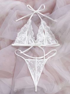 Indulge in luxury with our White Lingerie Set Mesh. Made with delicate lace, this set exudes elegance and sophistication. The mesh fabric adds a touch of sensuality, making you feel confident and alluring. Perfect for a special night or everyday wear. Feminine String Bra With Delicate Lace, Elegant Lace Bra For Wedding Night, Elegant Underwire Bra For Wedding Night, Elegant String Bra, Elegant Fitted String Bra, Elegant Wedding String Bra, Elegant String Wedding Bra, Elegant String Bra For Wedding, Elegant Lace Set For Wedding Night