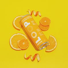 an orange juice can surrounded by sliced oranges