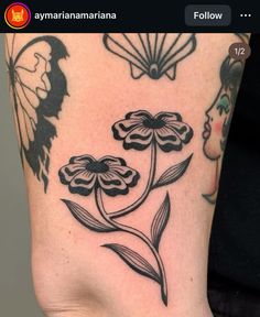 a woman's foot with flowers on it and butterflies flying around the bottom part