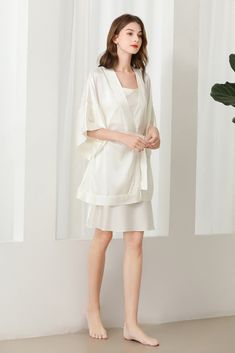 Fabric: 92% 19 Momme mulberry silk 8% Spandex Color: White Care: Hand wash or dry clean Silk robe dressing gown. Dolman sleeves. Shawl collar. Dropped shoulders. Open front. Fastens with a matching belt. Closing edge. Unlined. This wrap is designed with kimono proportions, but with a more modern short length. Silk Kimono Robe, Silk Robe, Grad Dresses, Silk Kimono, Dressing Gown, Dress Ideas, Sleepwear Women, Mulberry Silk, Shawl Collar