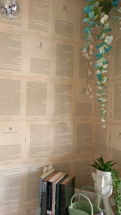 the wall is covered with many books and flowers