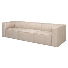 a beige couch sitting on top of a white floor