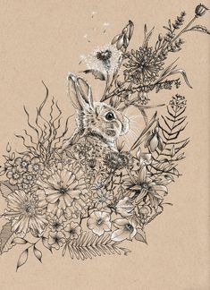 a drawing of a rabbit surrounded by flowers