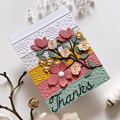 a close up of a card with flowers on it