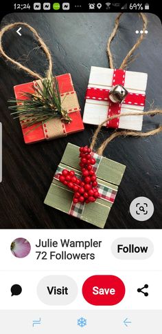 two small wrapped gift boxes with red berries tied to them, on a table top