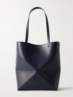 Bags have had a functional update this season - it's all about styles that can be converted so you can get maximum mileage. Loewe's medium 'Puzzle' tote has an origami-like construction that can be folded down when you're storing it or traveling. The leather is smooth and slouchy and the suede lining exquisitely soft. Loewe Puzzle, Raffia Bag, Classic Bags, The Tote Bag, Medium Tote, Shoe Print, Green Bag, Net A Porter, Body Bag