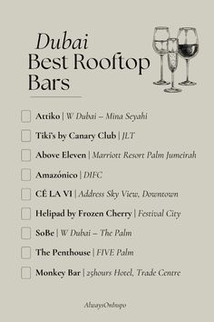 a menu with two glasses of wine on it and the words, dubai best rooftop bars