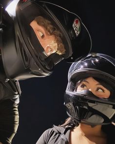 two mannequins with helmets on their heads and one is wearing a motorcycle helmet