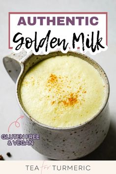 a mug filled with golden milk and topped with cinnamon sprinkled on the side