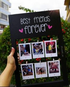 a person holding up a sign that says best friends forever with photos attached to it