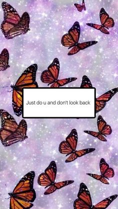 many orange butterflies flying in the sky with a white sign that says just do us and don't look back