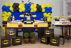 a batman themed birthday party with balloons and decorations