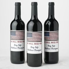 three bottles of wine with an american flag on them, sitting next to each other