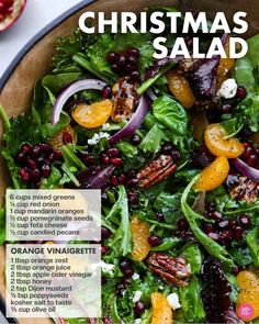 a salad with oranges, cranberries and pecans in it on a plate