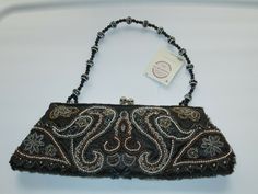 This listing is for a NEW Beautiful BEADED PURSEor EVENING BAG from Passports Fashion Express. It has a Black background with multi-colored beads in a Paisley and Flowers design.Beaded strap. It measures approx. 11" l x 4 1/2" h with a 7" strap drop. Tag reads "Sparkle Plenty". FREE SHIPPING!   Thanks for looking and please check out my other listings.                       &nb Sparkle Purse, Beaded Clutch Purse, Clutch Purse Black, Beaded Strap, Embellished Clutch, Beaded Evening Bags, Beaded Clutch, Ladies Clutch, Flowers Design