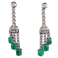 Elegant emerald and diamond drop earrings Metal: White Gold Weight: 13.5 grams Diamond Weight: 2.5 ct Diamond Color: H Diamond Clarity: SI1 Gemstone Weight: Approximately 6 ct Measurements: 2 1/4 x 1/2 inches Gold Diamond Drop Earrings, White Gold Drop Earrings, Royal Closet, Emerald Earrings Drop, Pearl And Diamond Earrings, Earrings Metal, Emerald Earrings, Earrings 3, Diamond Drops