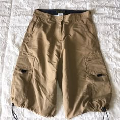 Tan Cargo Hiking Shorts. Drawstring Legs Large Cargo Side Pockets. Belted Waist. Waist Measures 15 "Across. 23" Length. Mean Girls Costume, Baggy Cargo Shorts, Knee Shorts, Khaki Cargo Shorts, Tan Shorts, Cargo Khaki, Cargo Short, Group 1, Hiking Shorts