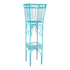 a blue metal plant stand with scissors on it's top and two shelves below