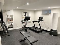 a home gym with treadmills and exercise equipment