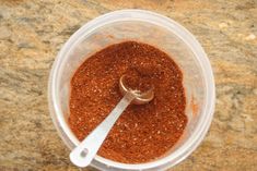 a blender filled with spices on top of a counter