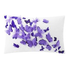 a pillow with purple butterflies on it