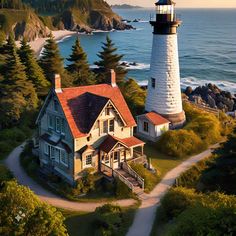 an aerial view of a house with a lighthouse on the top and ocean in the background