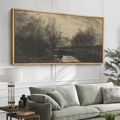 a living room filled with furniture and a painting on the wall