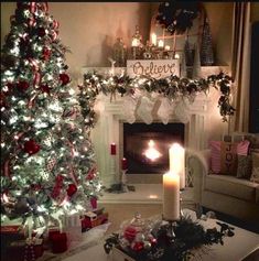 a living room decorated for christmas with a fireplace