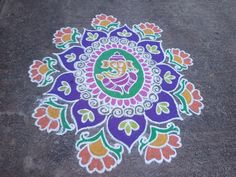 a colorful rangdi design on the ground